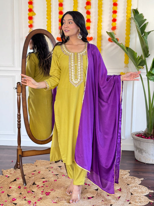 Radiate elegance in this mustard Kurti set, beautifully adorned with intricate mirror work and paired with a rich purple dupatta