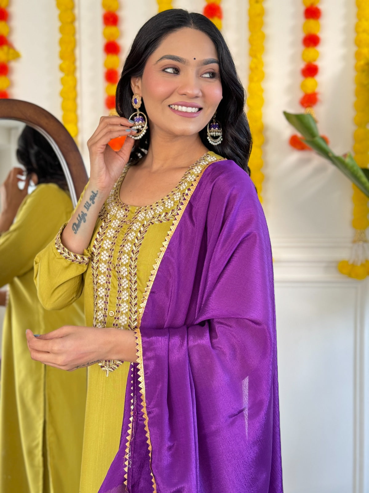 Radiate elegance in this mustard Kurti set, beautifully adorned with intricate mirror work and paired with a rich purple dupatta
