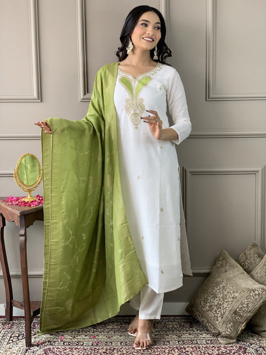 Exude grace in this pristine white Kurti set, adorned with delicate embroidery and paired with an elegant green dupatta