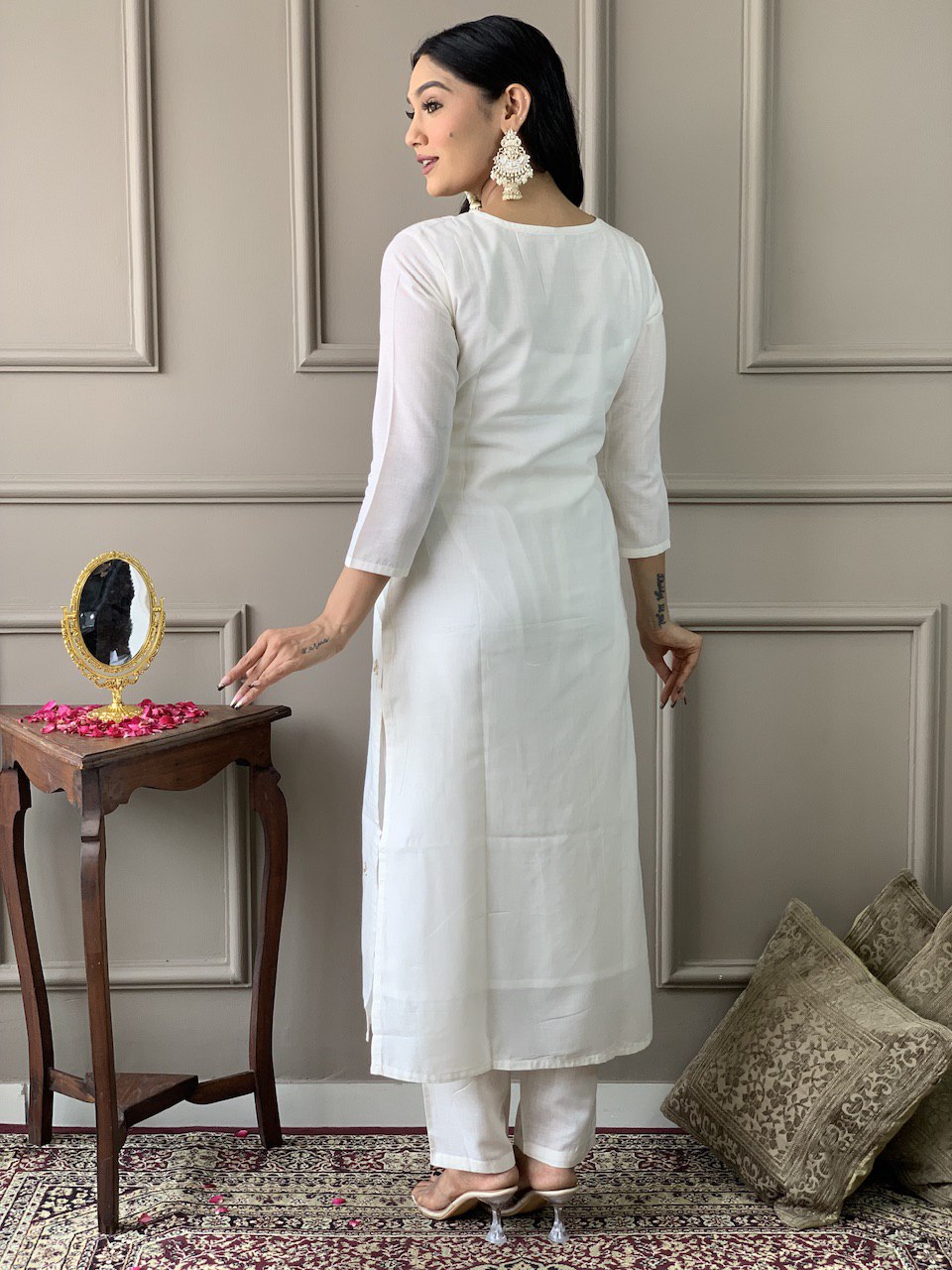 Exude grace in this pristine white Kurti set, adorned with delicate embroidery and paired with an elegant green dupatta