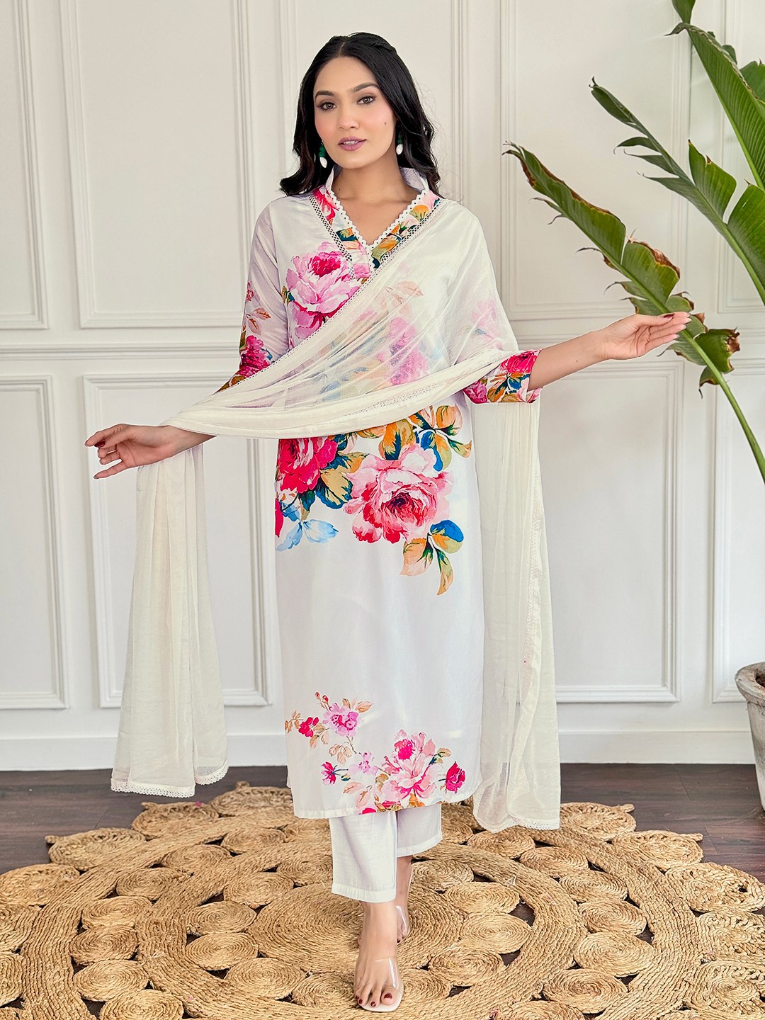 "Embrace elegance with this stunning white floral Kurti set, featuring vibrant blooms and delicate embroidery