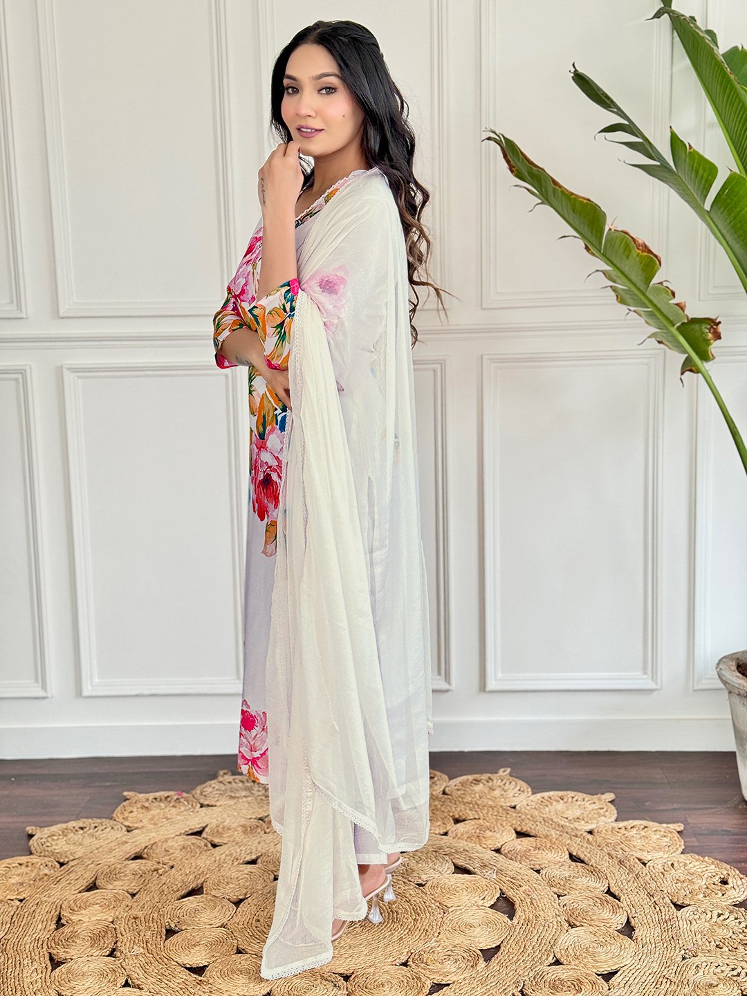 "Embrace elegance with this stunning white floral Kurti set, featuring vibrant blooms and delicate embroidery