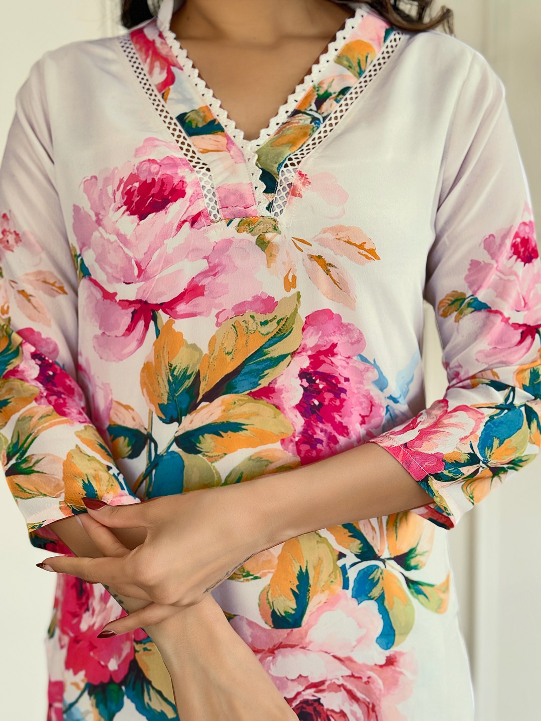"Embrace elegance with this stunning white floral Kurti set, featuring vibrant blooms and delicate embroidery