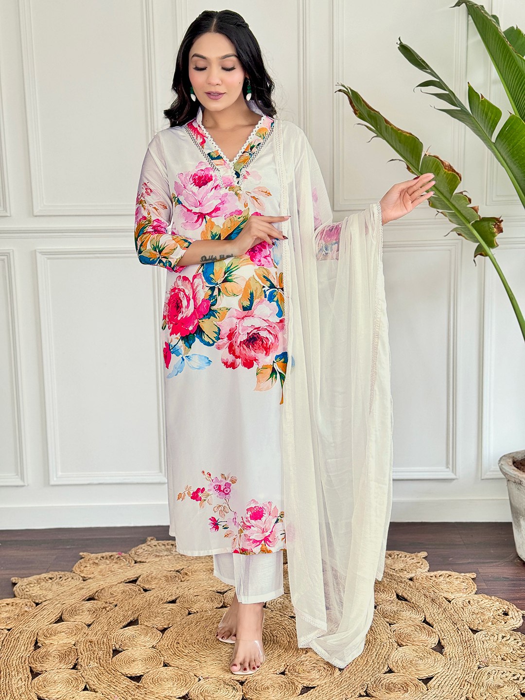 "Embrace elegance with this stunning white floral Kurti set, featuring vibrant blooms and delicate embroidery