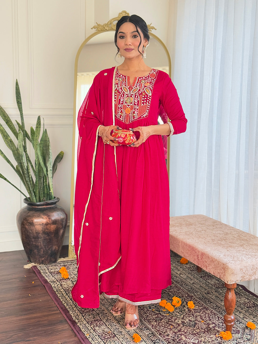 Make a statement with this stunning red kurti set, featuring intricate embroidery and a flowy silhouette for timeless elegance