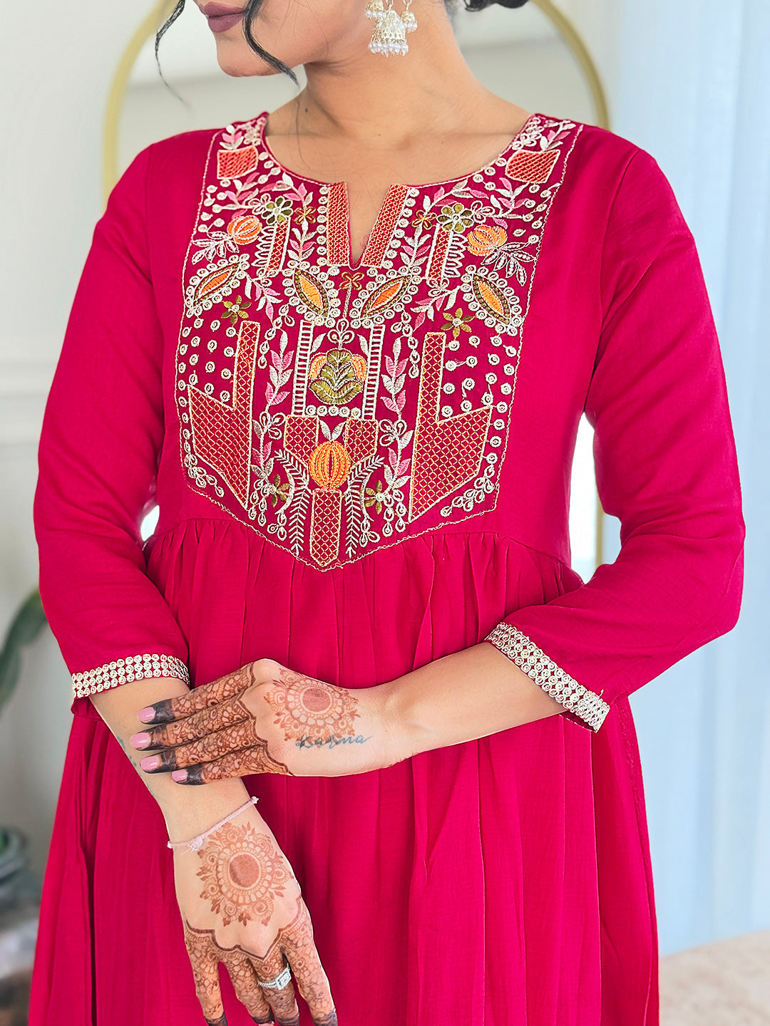 Make a statement with this stunning red kurti set, featuring intricate embroidery and a flowy silhouette for timeless elegance