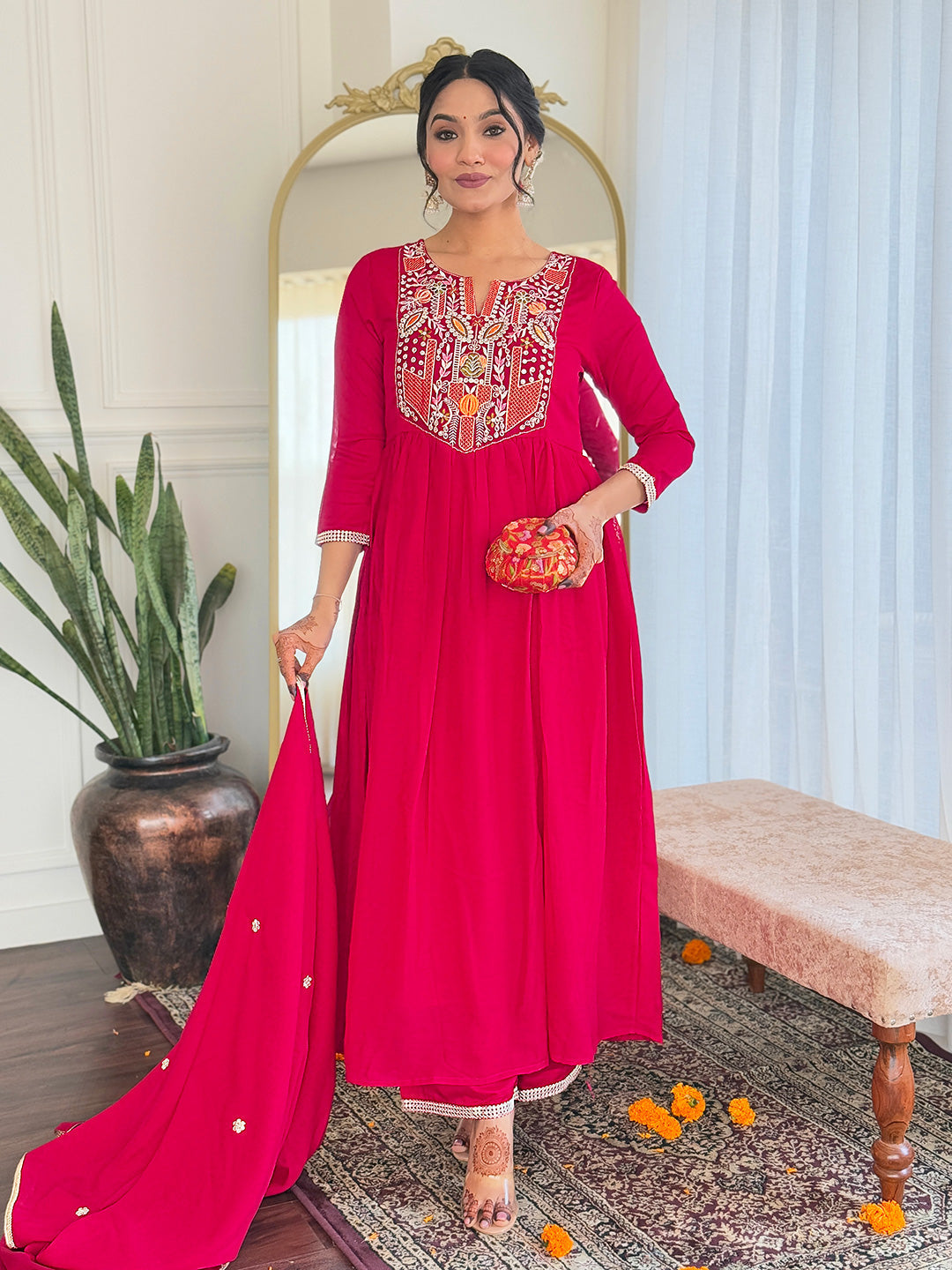 Make a statement with this stunning red kurti set, featuring intricate embroidery and a flowy silhouette for timeless elegance
