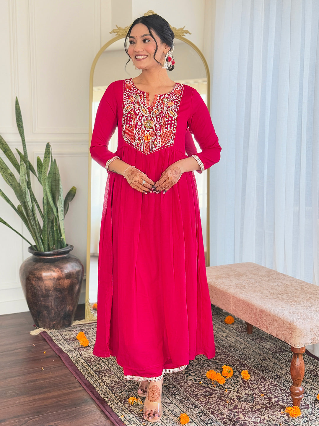Make a statement with this stunning red kurti set, featuring intricate embroidery and a flowy silhouette for timeless elegance