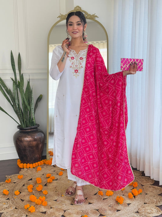 Elevate your elegance with this stunning white kurti set, adorned with intricate embroidery and paired with a vibrant pink bandhani dupatta