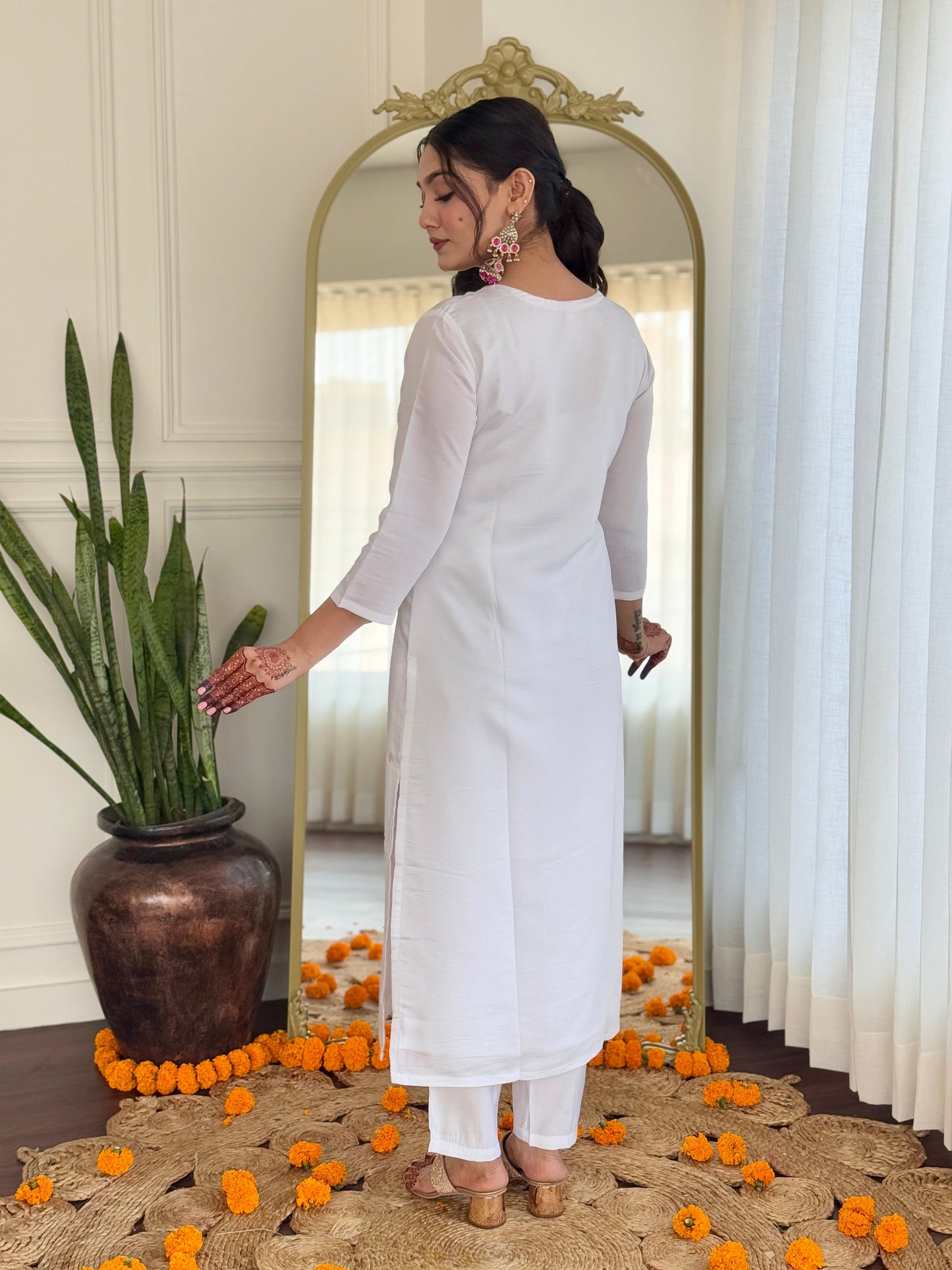 Elevate your elegance with this stunning white kurti set, adorned with intricate embroidery and paired with a vibrant pink bandhani dupatta
