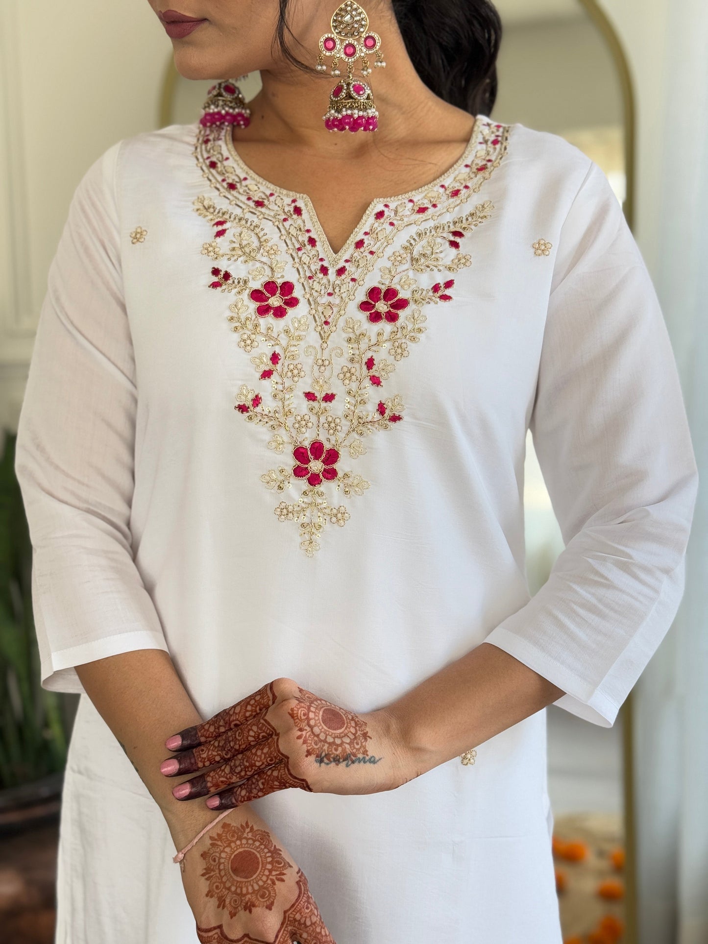 Elevate your elegance with this stunning white kurti set, adorned with intricate embroidery and paired with a vibrant pink bandhani dupatta