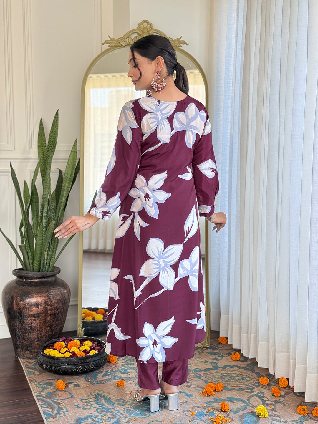 Elevate your wardrobe with this stunning maroon kurti set, adorned with bold floral prints and intricate neckline embellishments