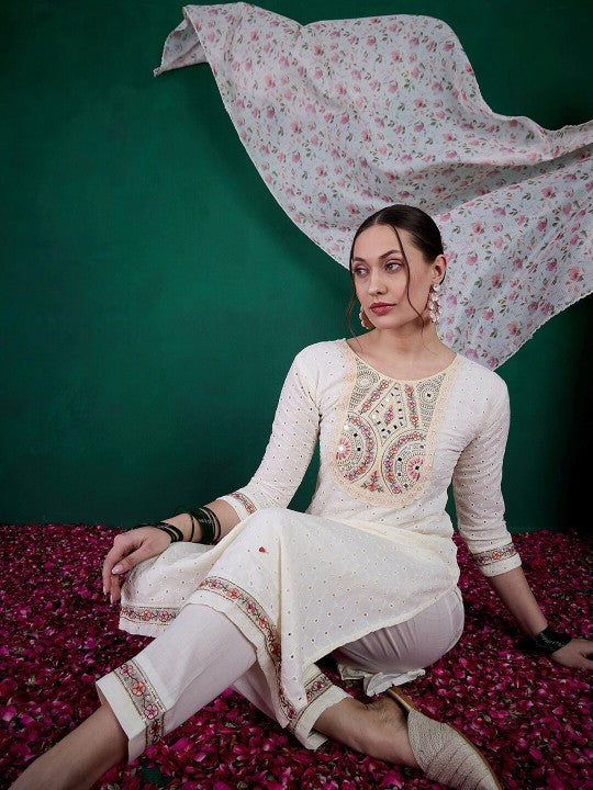 Embrace elegance with this exquisite white kurti set, featuring delicate mirror work, intricate embroidery, and a floral-printed dupatta