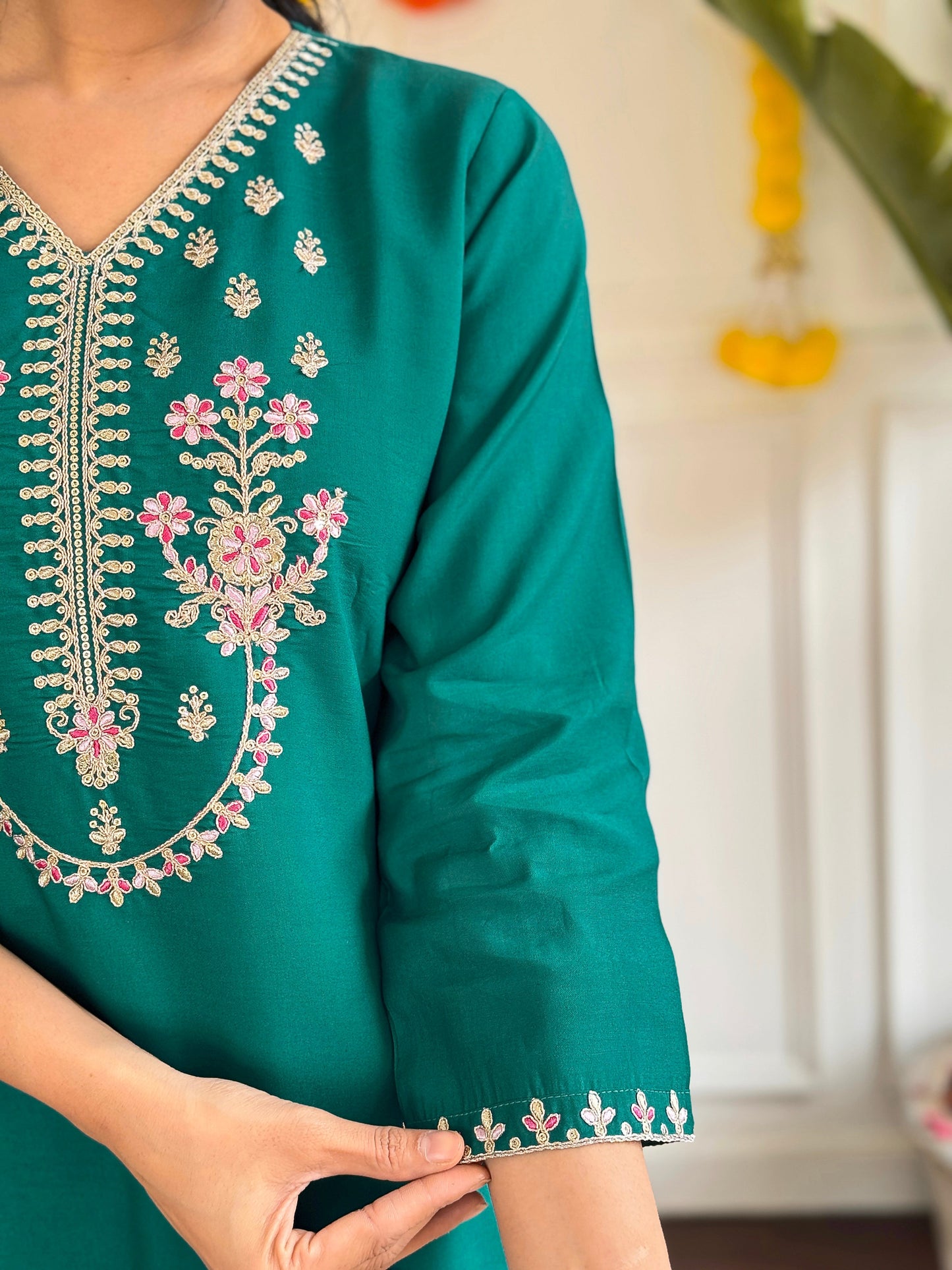 Add a pop of elegance to your wardrobe with this vibrant green kurti set. Featuring delicate floral embroidery