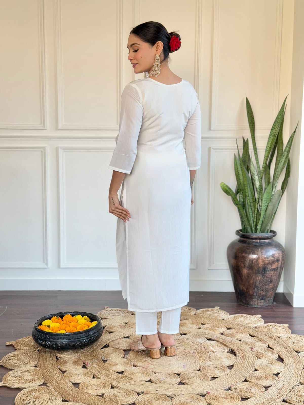 Grace meets tradition in this stunning white kurti set, highlighted with intricate embroidery and a vibrant pink Banarasi dupatta