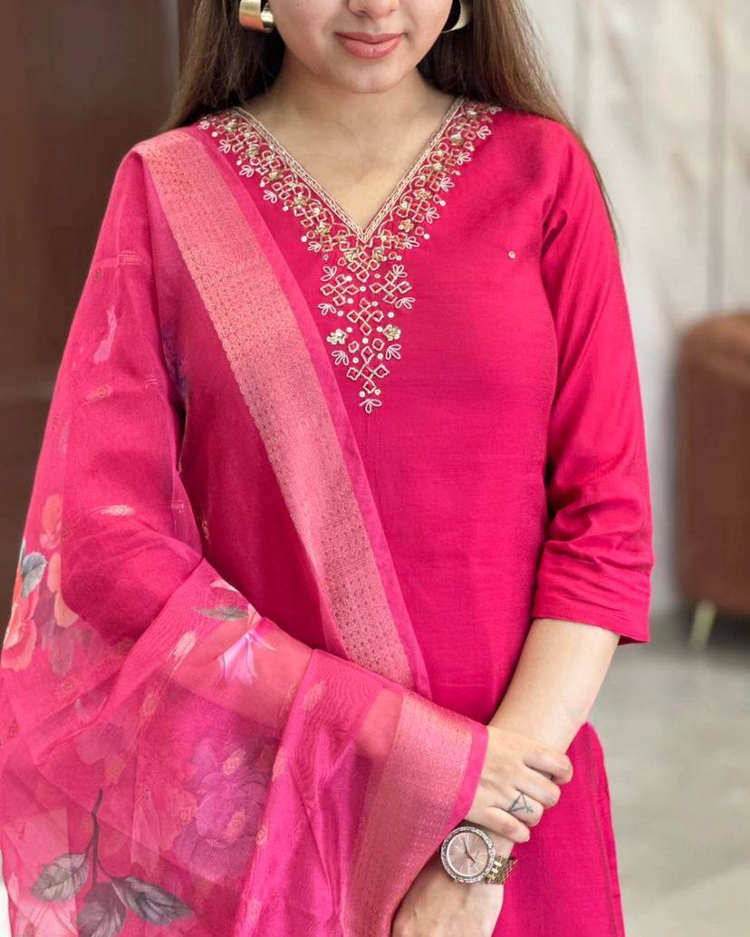 This stunning pink kurti set features elegant embroidery on the neckline and a floral-printed dupatta for a graceful touch