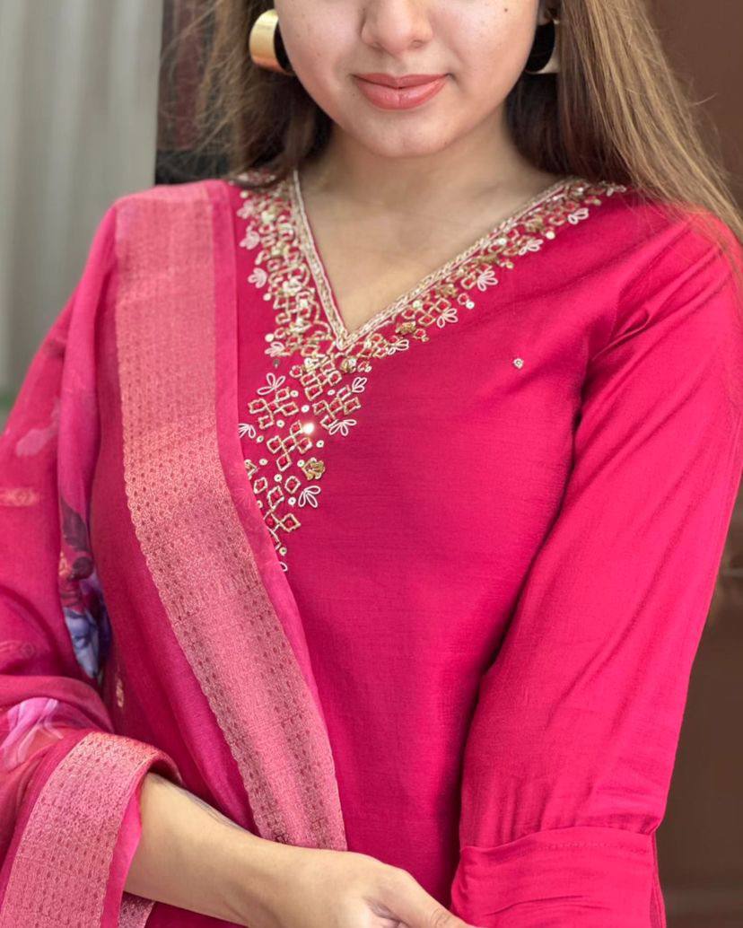 This stunning pink kurti set features elegant embroidery on the neckline and a floral-printed dupatta for a graceful touch