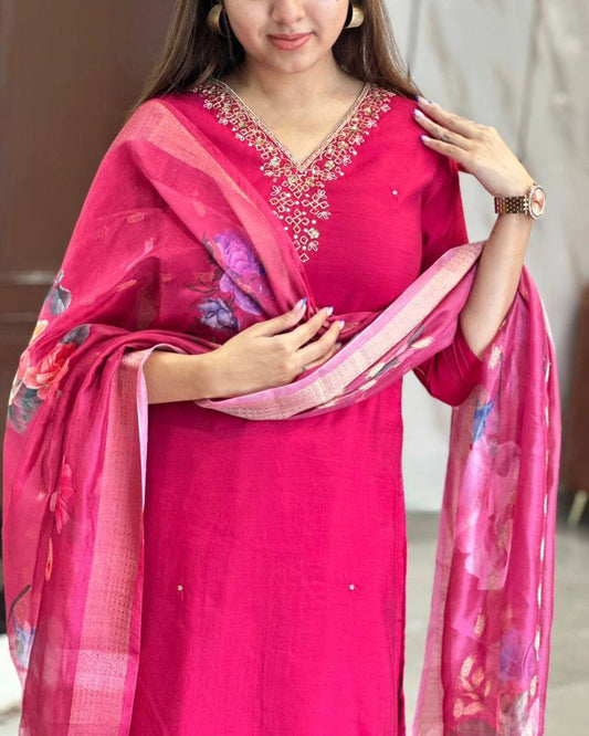 This stunning pink kurti set features elegant embroidery on the neckline and a floral-printed dupatta for a graceful touch