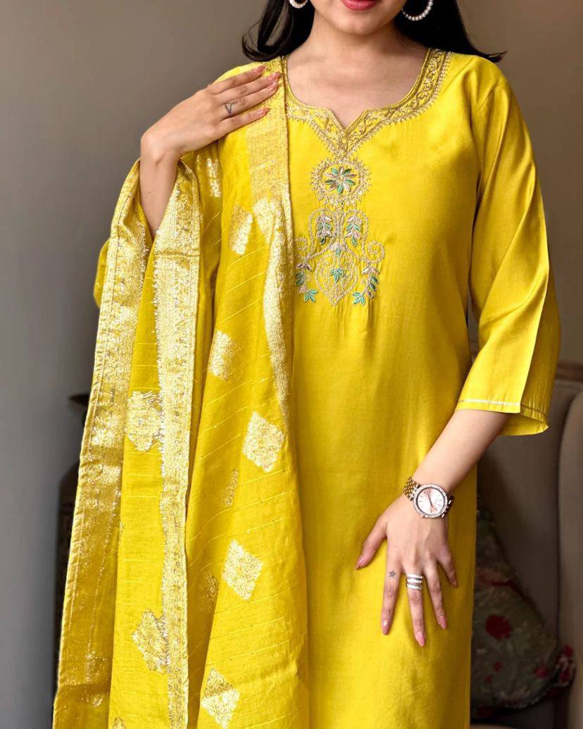 Radiate elegance in this vibrant yellow kurti set, featuring intricate embroidery on the neckline and a rich, golden-accented dupatta