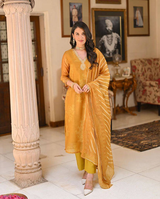 Radiate grace in this mustard yellow kurti set, adorned with intricate embroidery and a beautifully patterned dupatta