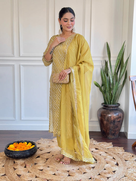 Radiate elegance in this mustard yellow kurti set, adorned with classic stripes and delicate golden detailing