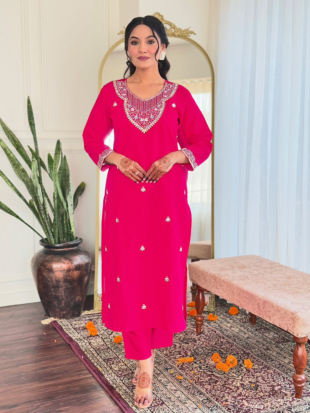 Step into elegance with this vibrant pink kurti set, adorned with delicate embellishments and a multicolored bandhani dupatta
