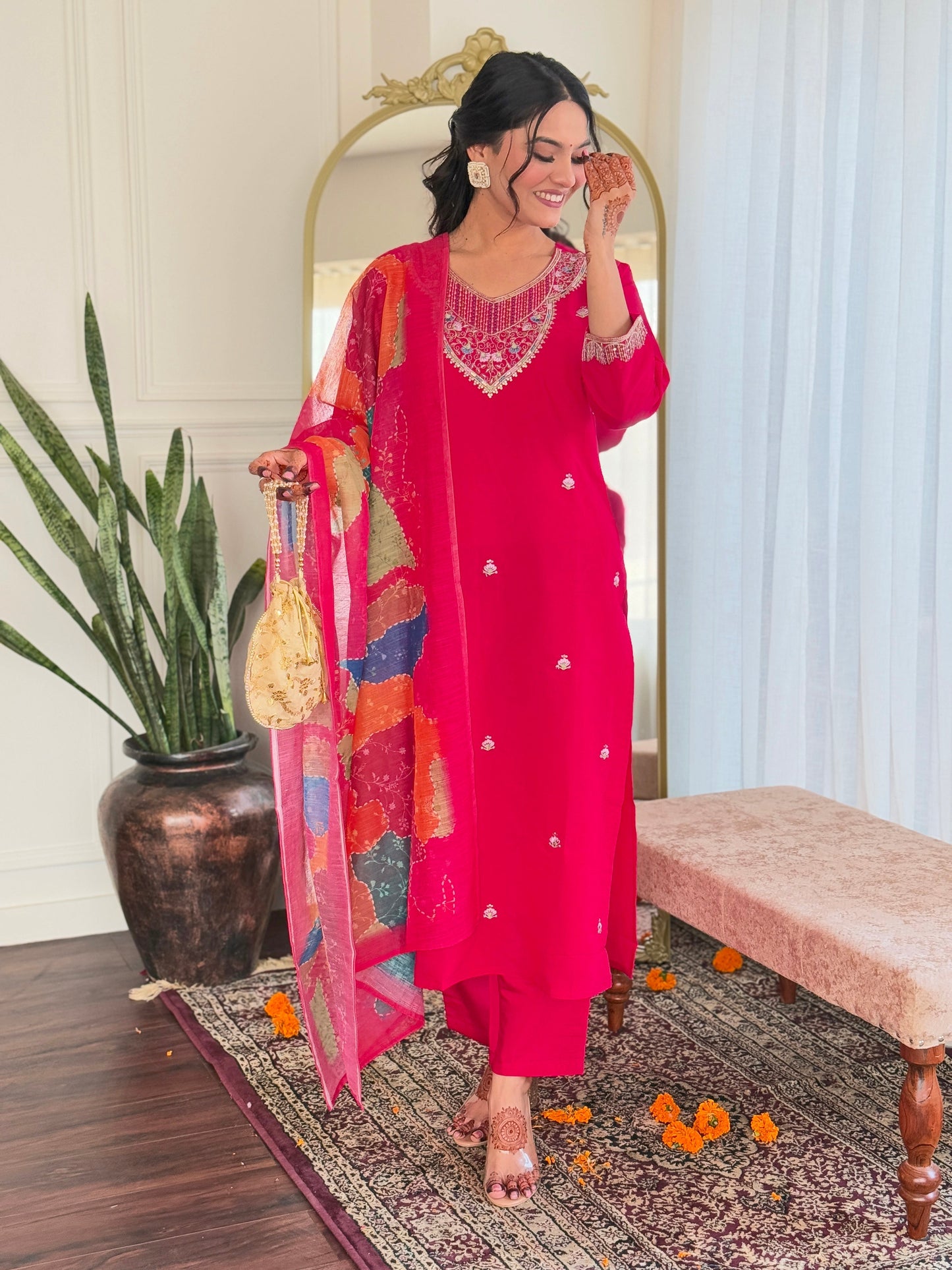 Step into elegance with this vibrant pink kurti set, adorned with delicate embellishments and a multicolored bandhani dupatta