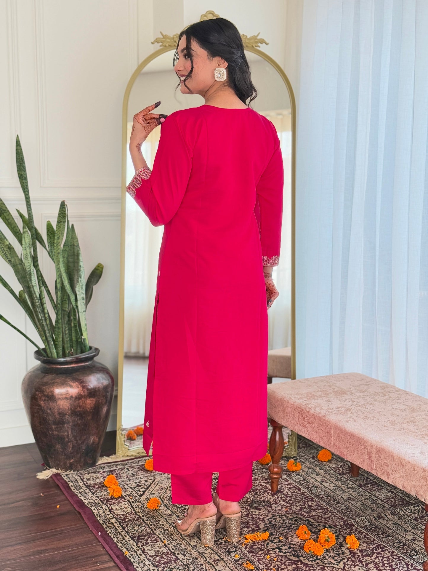 Step into elegance with this vibrant pink kurti set, adorned with delicate embellishments and a multicolored bandhani dupatta