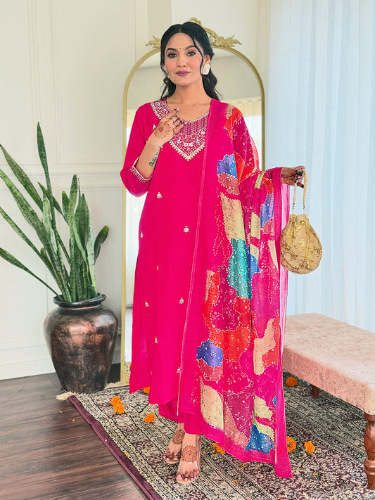 Step into elegance with this vibrant pink kurti set, adorned with delicate embellishments and a multicolored bandhani dupatta