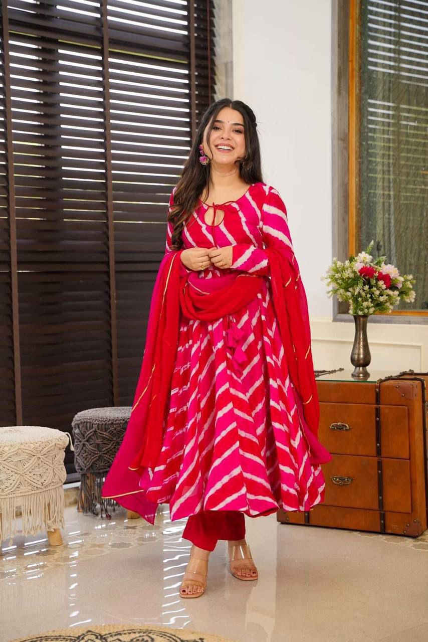 Radiate charm in this stunning pink tie-dye kurti set, featuring a flowy silhouette, delicate keyhole neckline, and a complementing dupatta