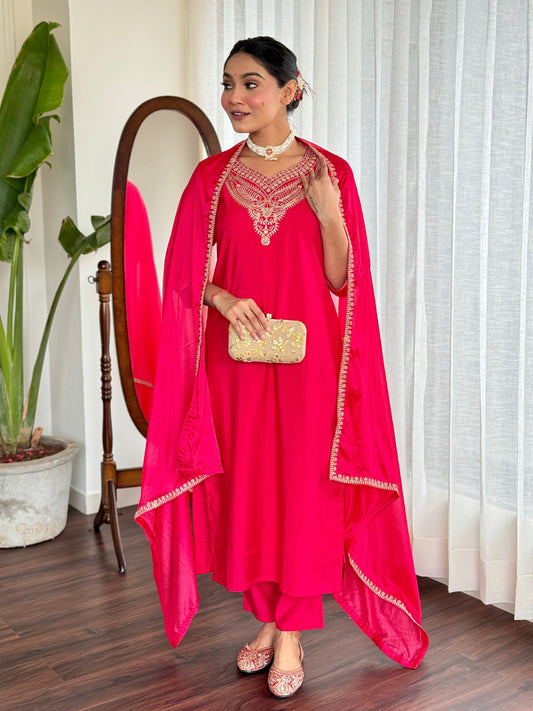 Make a bold statement with this stunning red kurti set, featuring intricate gold embroidery and a luxurious silk dupatta