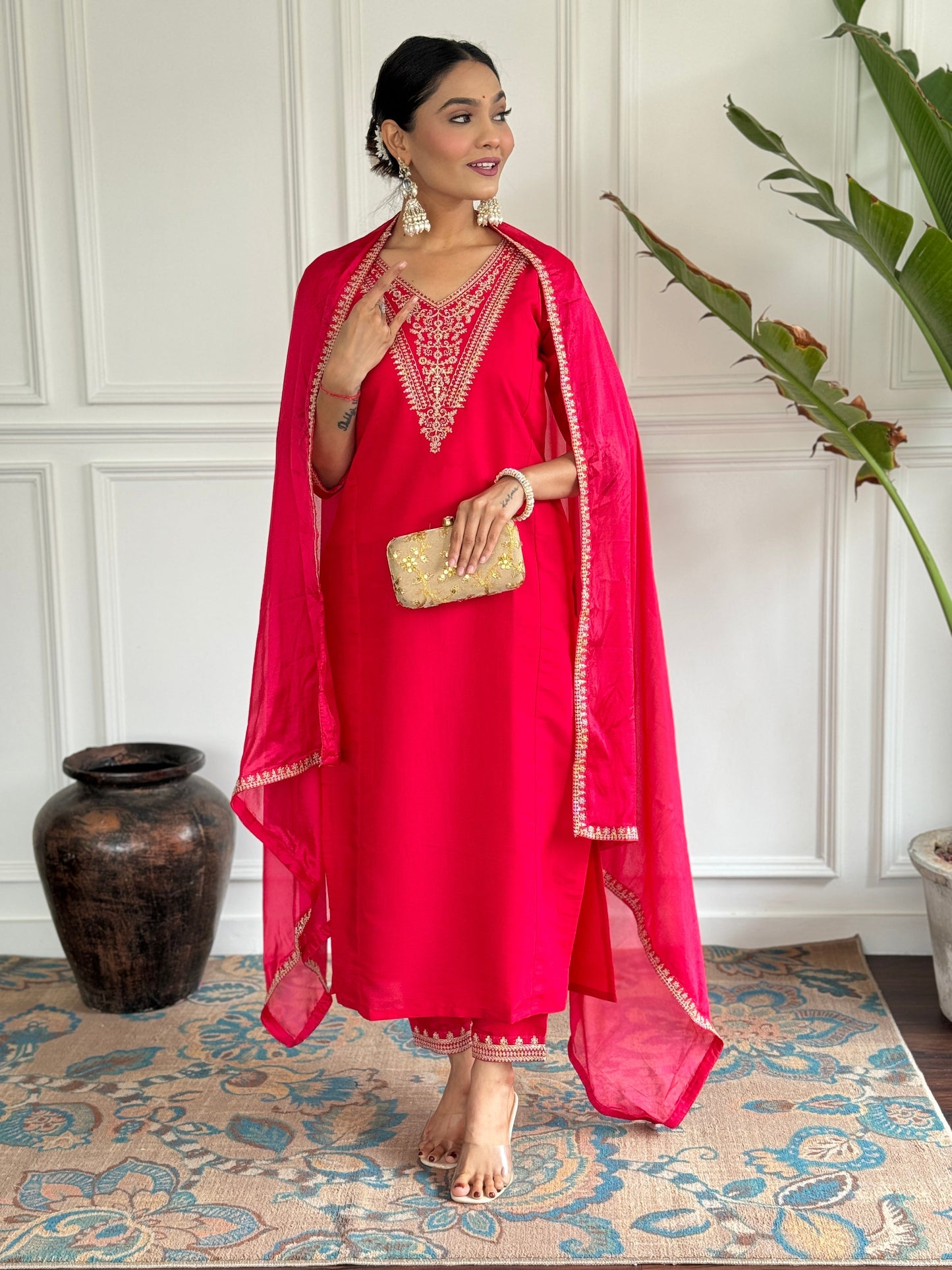 Turn heads in this stunning red kurti set, featuring intricate gold embroidery for a regal touch