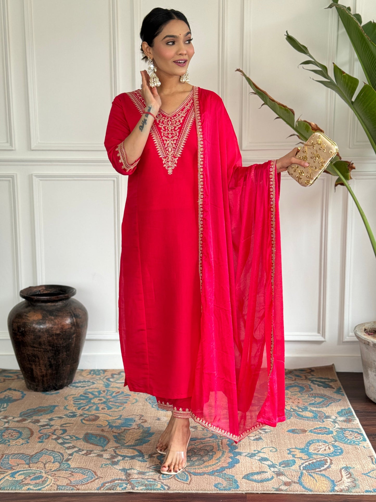 Turn heads in this stunning red kurti set, featuring intricate gold embroidery for a regal touch