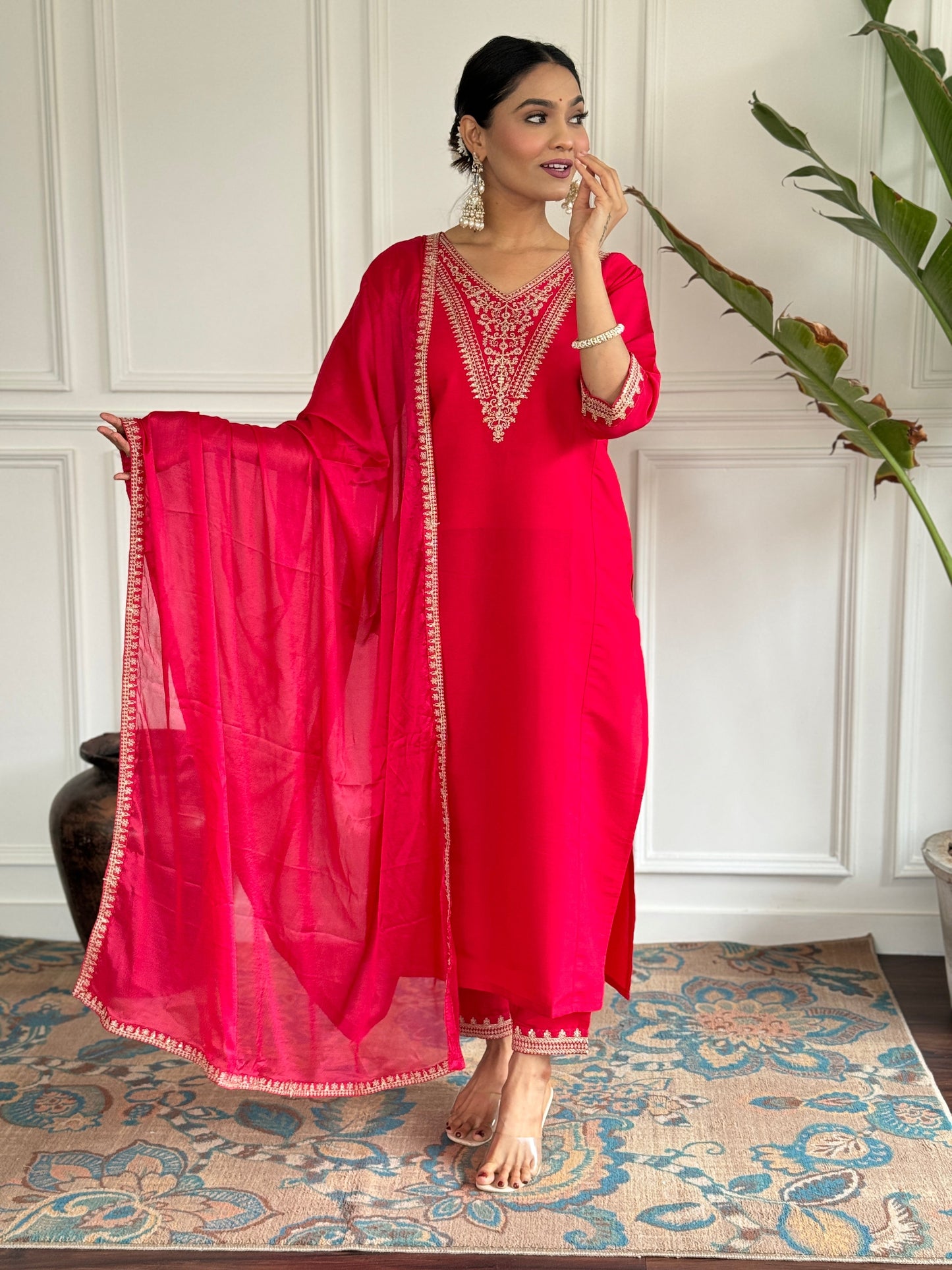 Turn heads in this stunning red kurti set, featuring intricate gold embroidery for a regal touch