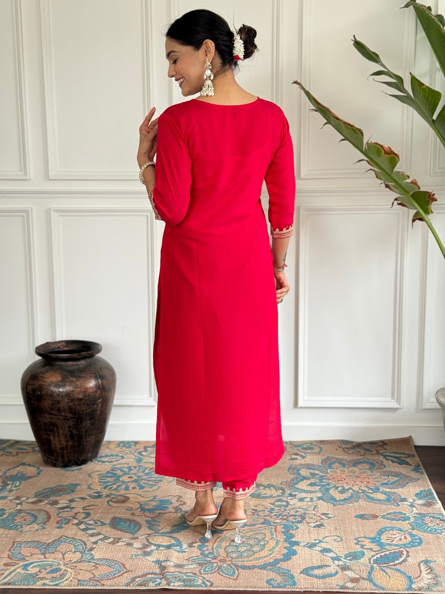 Turn heads in this stunning red kurti set, featuring intricate gold embroidery for a regal touch