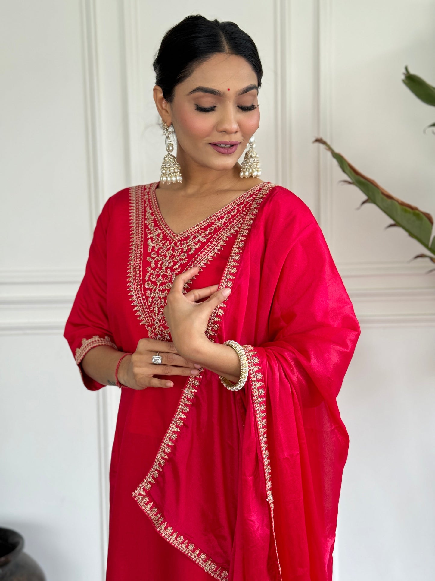 Turn heads in this stunning red kurti set, featuring intricate gold embroidery for a regal touch