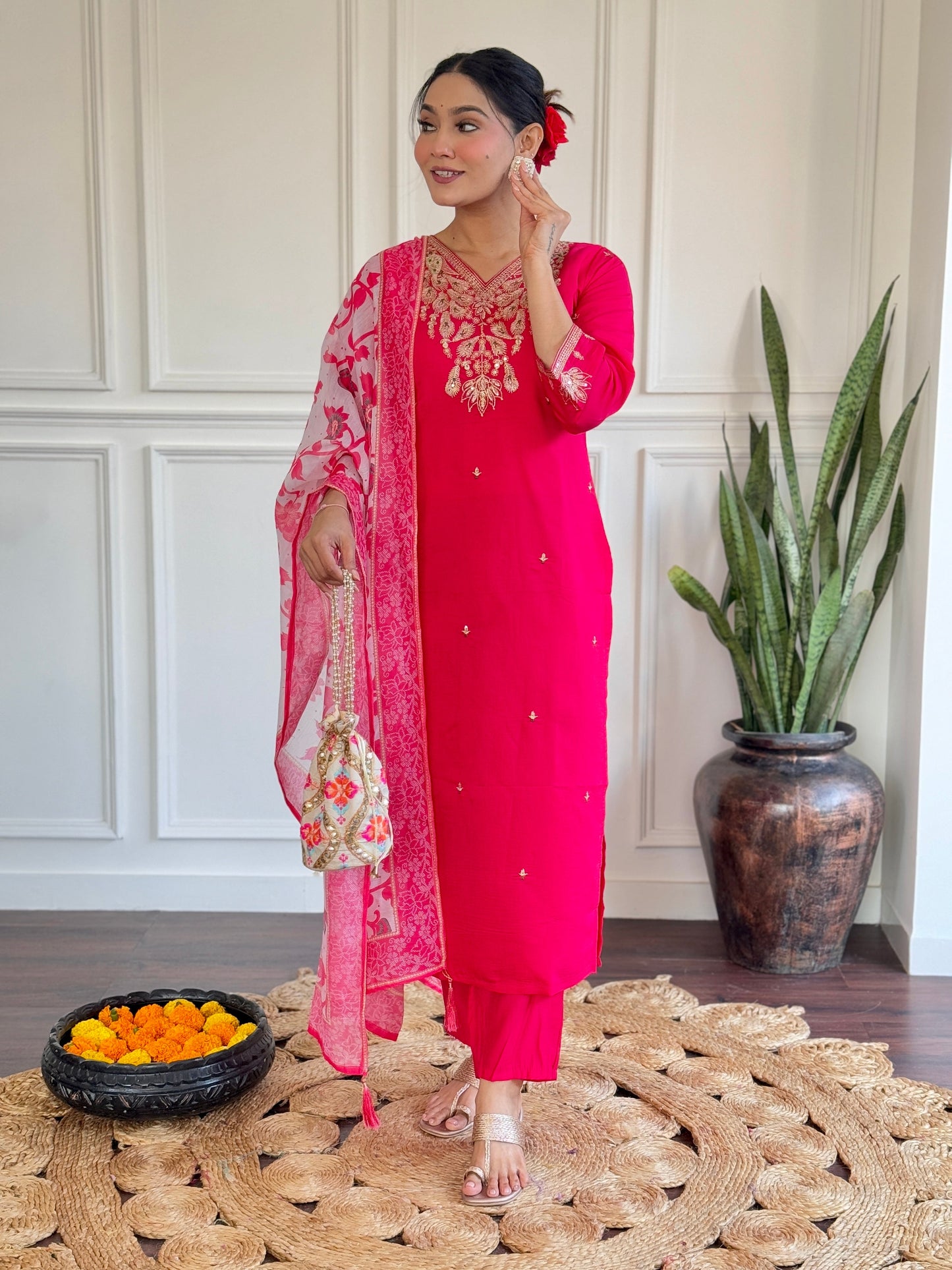 Radiate elegance in this vibrant pink kurti set, featuring exquisite gold embroidery and a beautifully printed floral dupatta