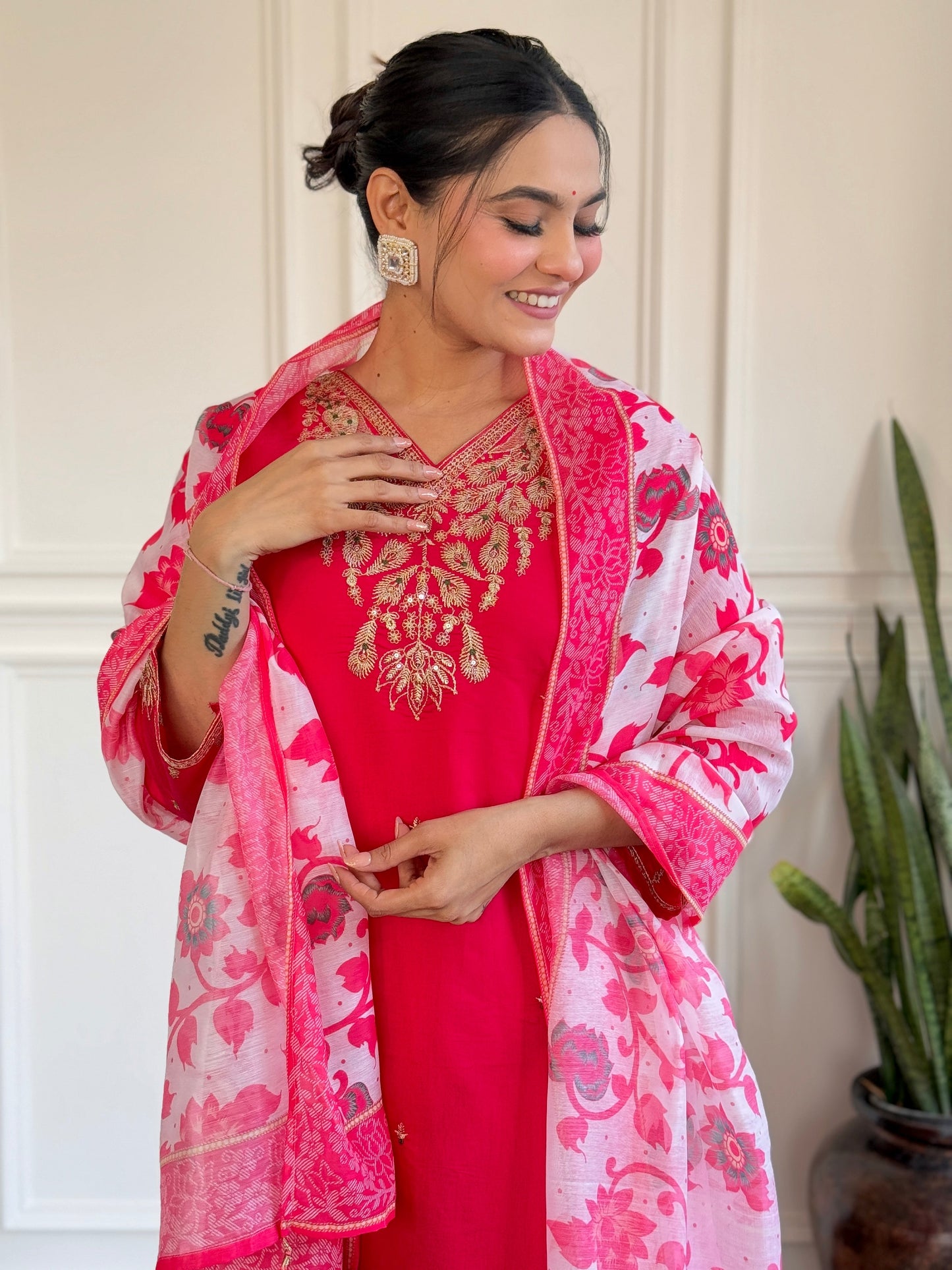 Radiate elegance in this vibrant pink kurti set, featuring exquisite gold embroidery and a beautifully printed floral dupatta