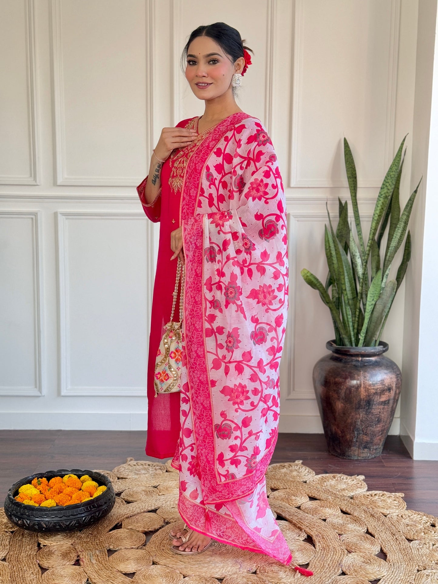 Radiate elegance in this vibrant pink kurti set, featuring exquisite gold embroidery and a beautifully printed floral dupatta