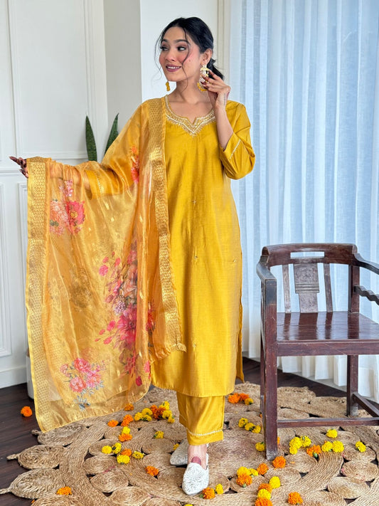 Embrace timeless elegance with this mustard yellow kurti set, adorned with delicate embroidery and paired with a floral organza dupatta