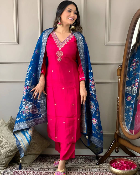 Embrace elegance with this stunning fuchsia pink kurti set, featuring delicate embroidery and a contrasting deep blue dupatta with intricate patterns