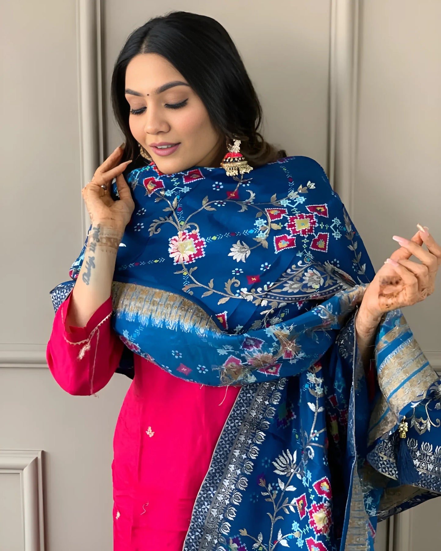 Embrace elegance with this stunning fuchsia pink kurti set, featuring delicate embroidery and a contrasting deep blue dupatta with intricate patterns