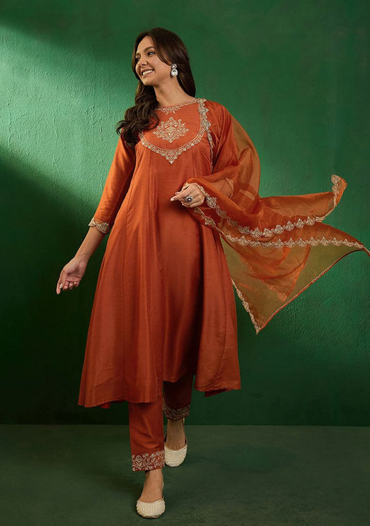 Radiate elegance in this rust-orange kurti set, adorned with intricate embroidery and a sheer embellished dupatta
