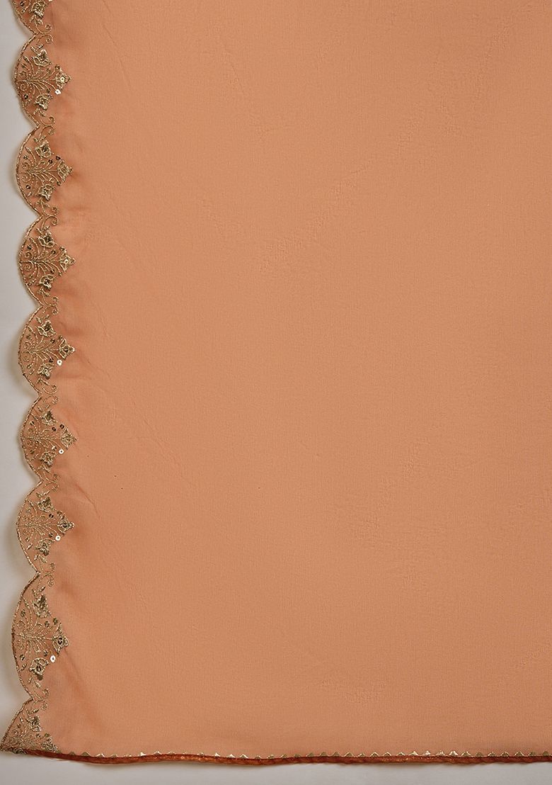 Radiate elegance in this rust-orange kurti set, adorned with intricate embroidery and a sheer embellished dupatta