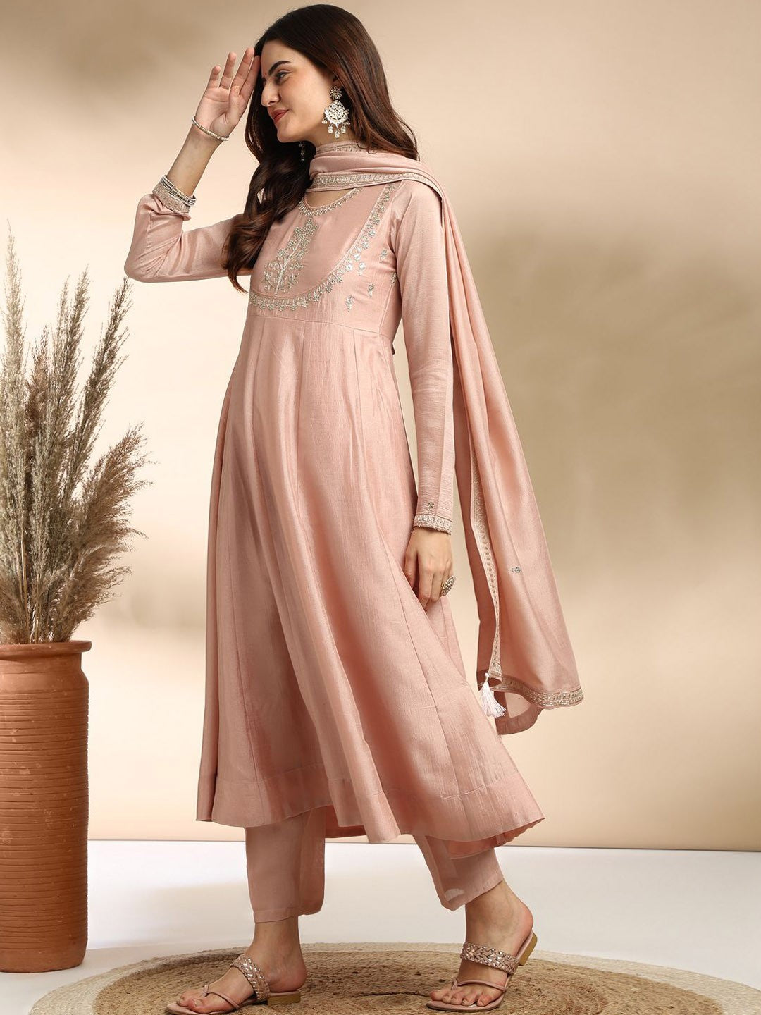 Elevate your wardrobe with this elegant maroon kurti set, adorned with delicate embroidery and a graceful silhouette