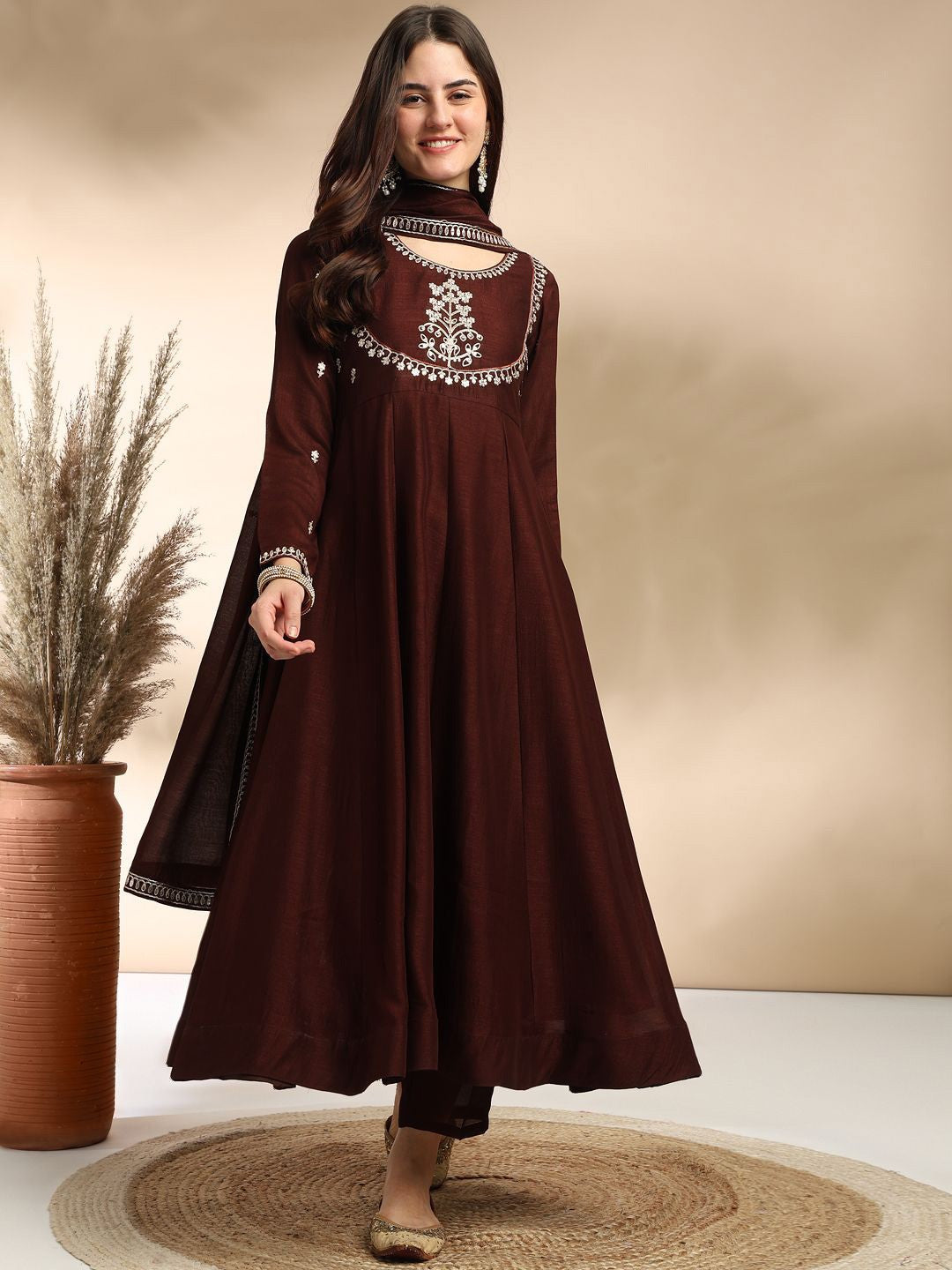 Elevate your wardrobe with this elegant maroon kurti set, adorned with delicate embroidery and a graceful silhouette