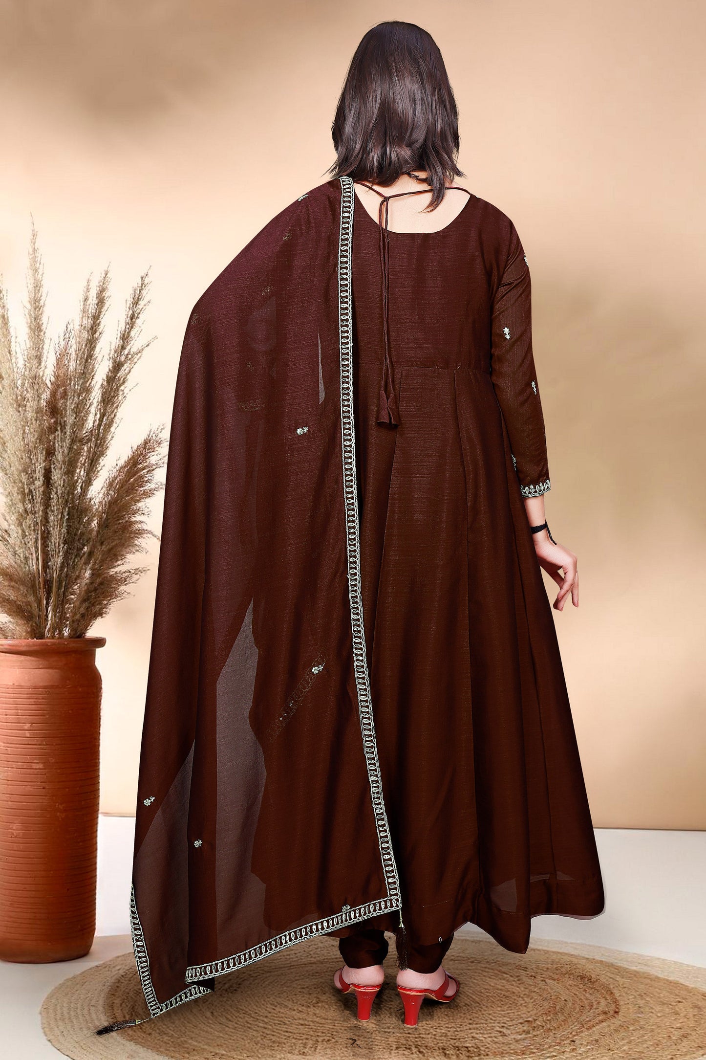 Elevate your wardrobe with this elegant maroon kurti set, adorned with delicate embroidery and a graceful silhouette