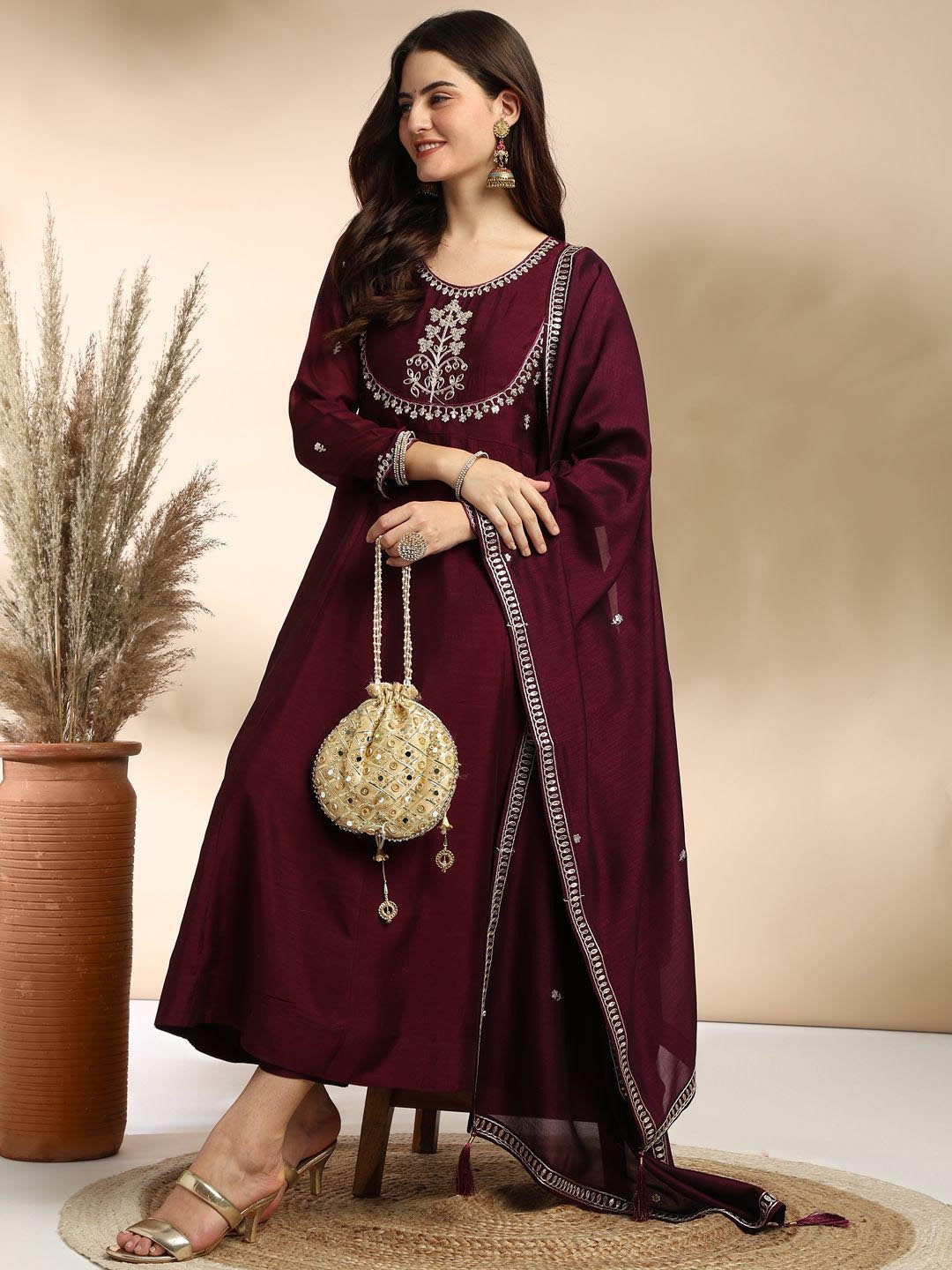 Elevate your wardrobe with this elegant maroon kurti set, adorned with delicate embroidery and a graceful silhouette