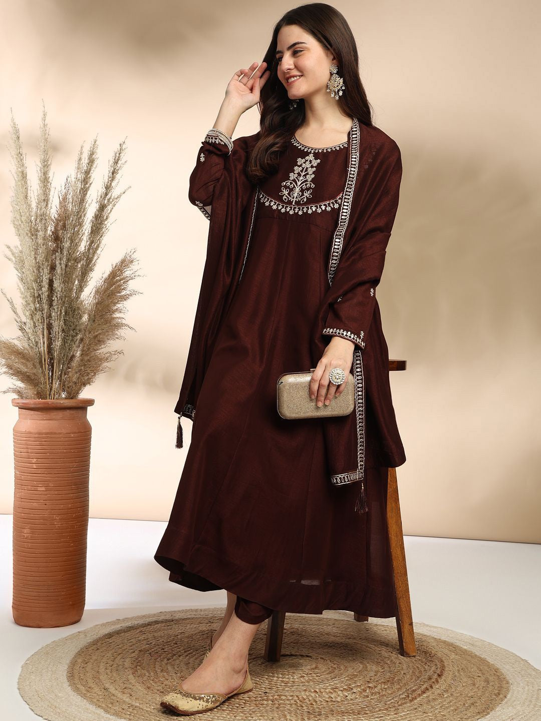 Elevate your wardrobe with this elegant maroon kurti set, adorned with delicate embroidery and a graceful silhouette