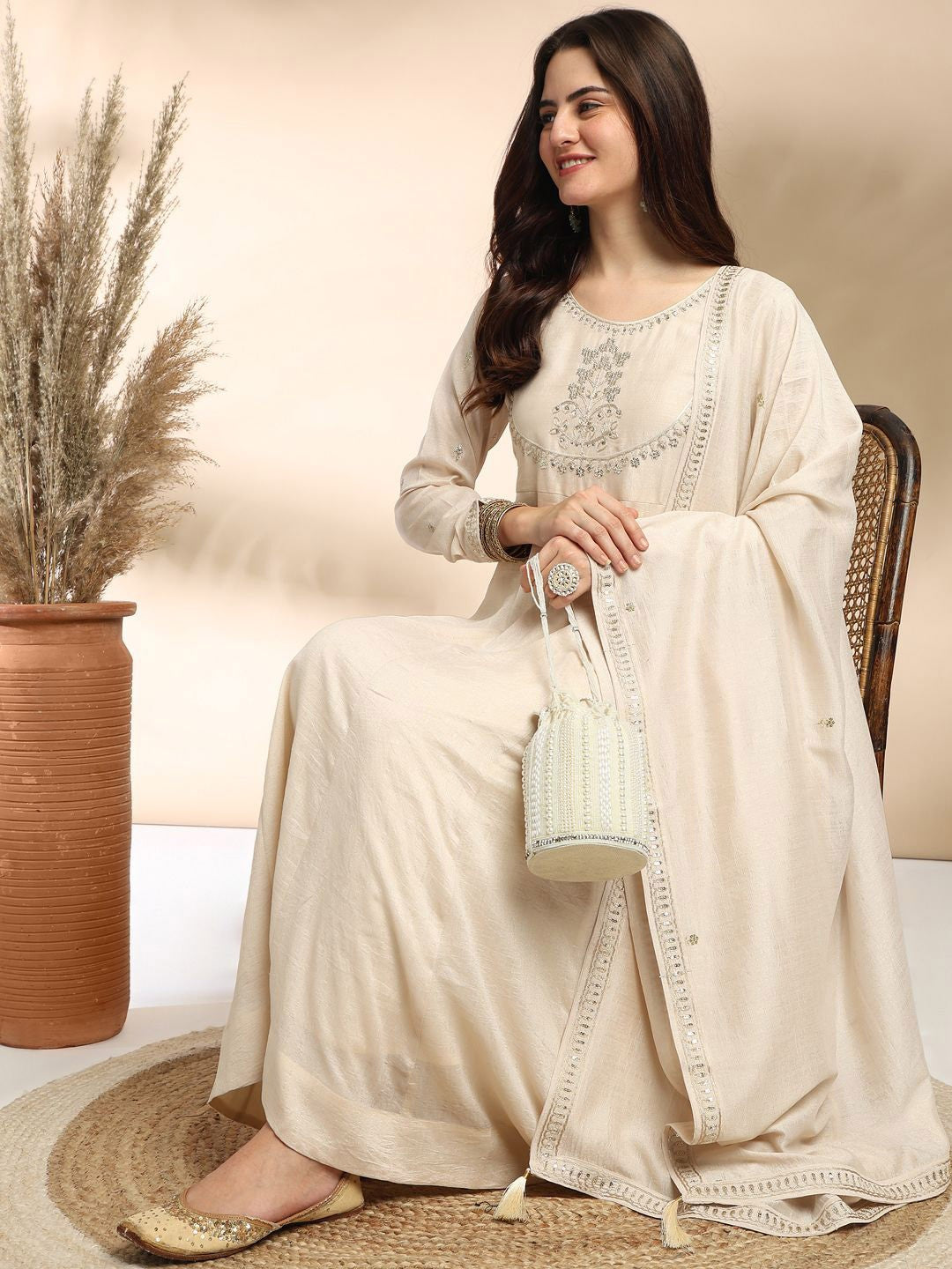 Elevate your wardrobe with this elegant maroon kurti set, adorned with delicate embroidery and a graceful silhouette